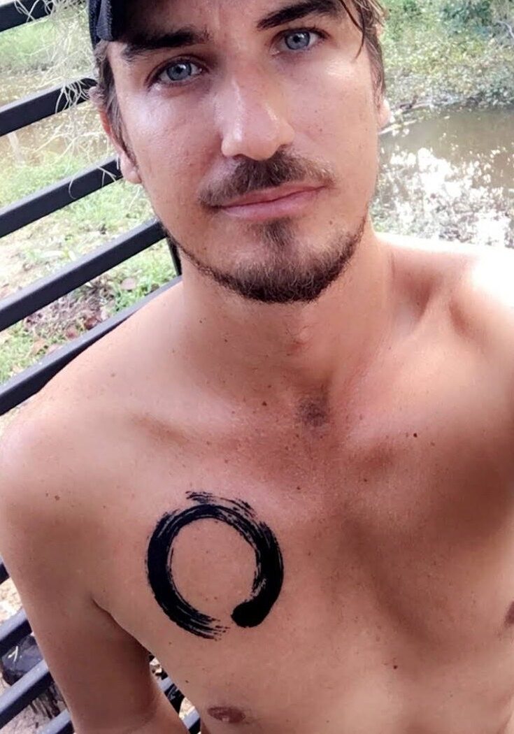 enso circle chest tattoo